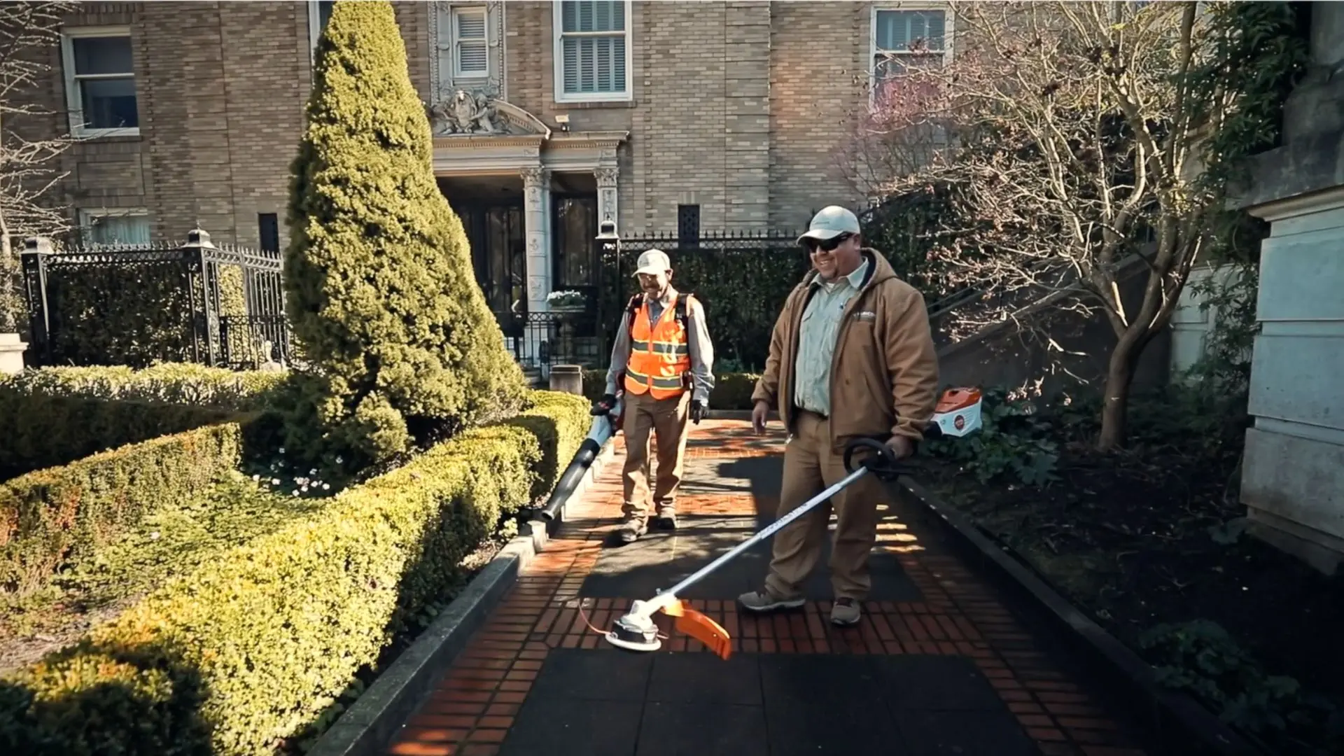 Rubicon crew members walking a landscaped campus walkway