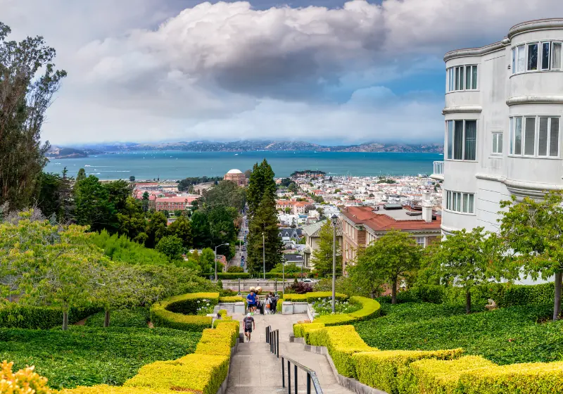 The Lyon Street Steps in San Francisco, with clipped hedges framing a view of the bay