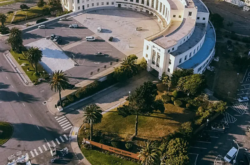 Aerial view of Treasure Island's historic administration building and palm-lined grounds